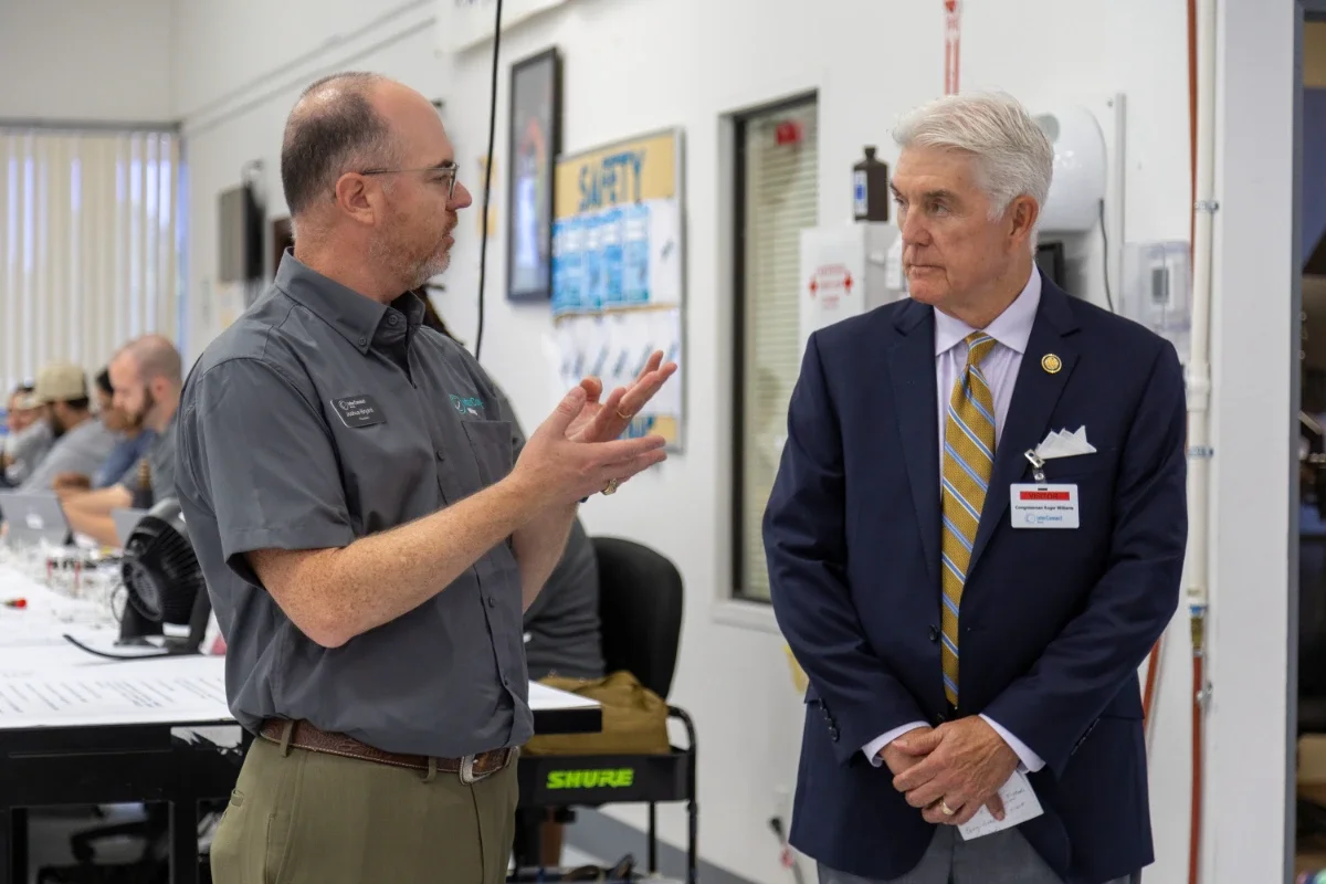 An InterConnect Wiring employee explains something to Congressman Roger Williams during a tour of the production floor.
